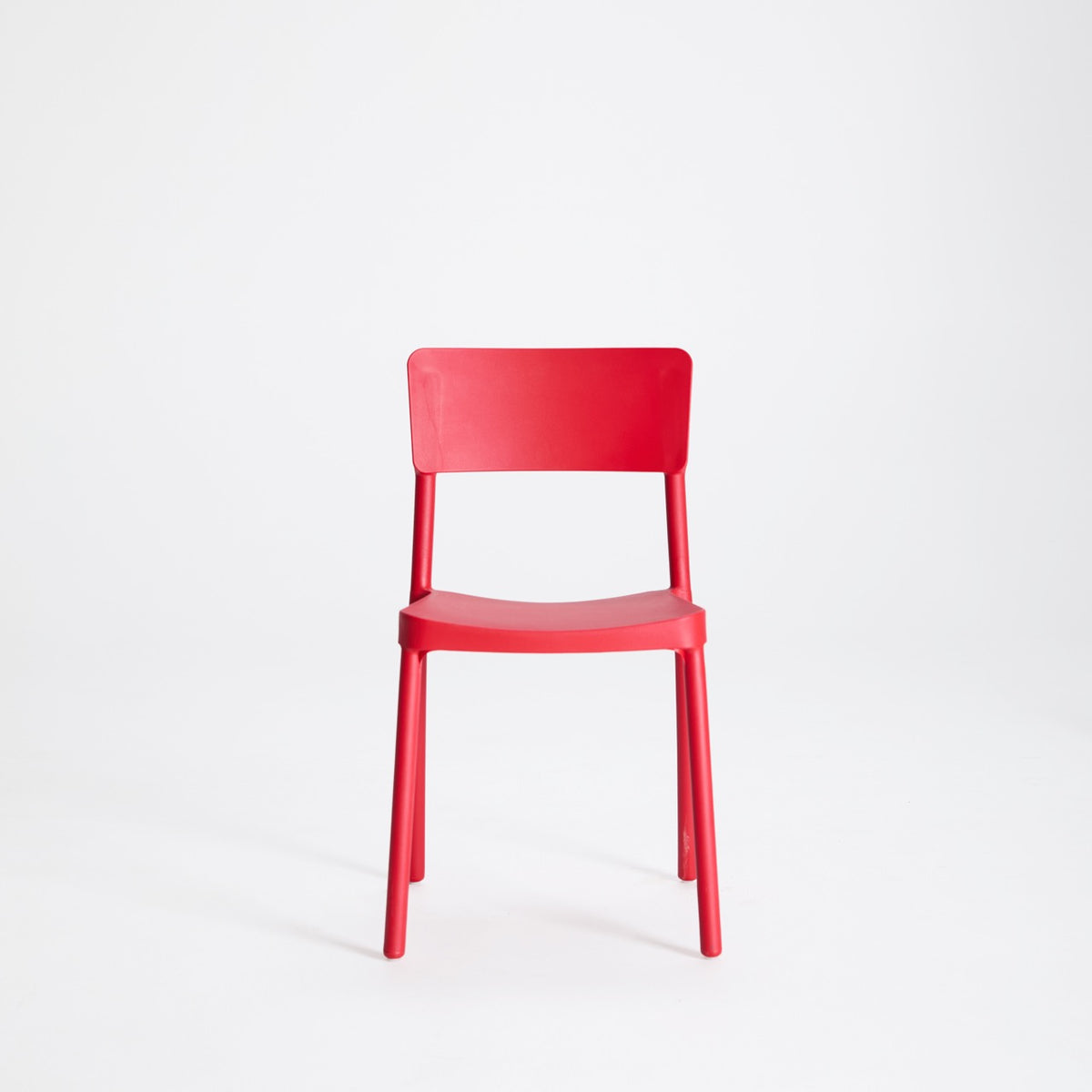 Ainsley red plastic chair prop, alternate view – Lunar Studios Sydney